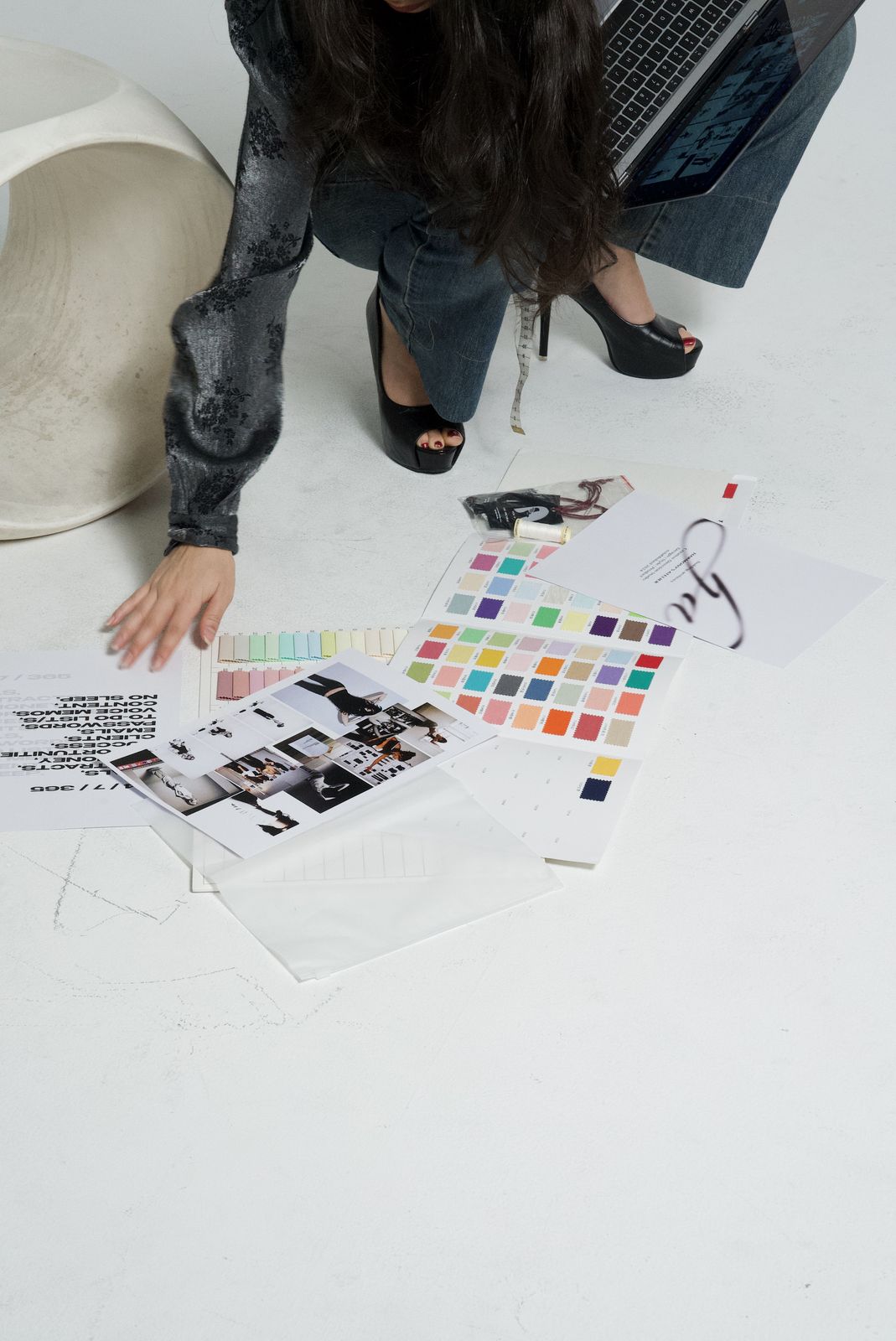 Colour swatch cards, mood boards and an ha print spread across the floor